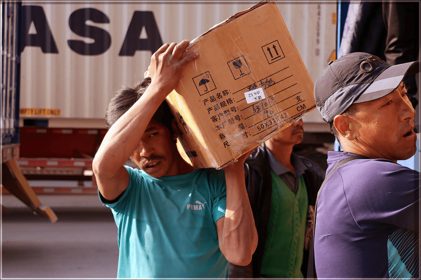 Worker carrying a package
